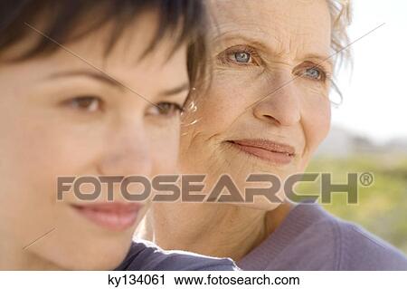 Senior woman and adult daughter, outdoors View Large Photo Image Stock Image - Senior woman and adult daughter, outdoors. Fotosearch