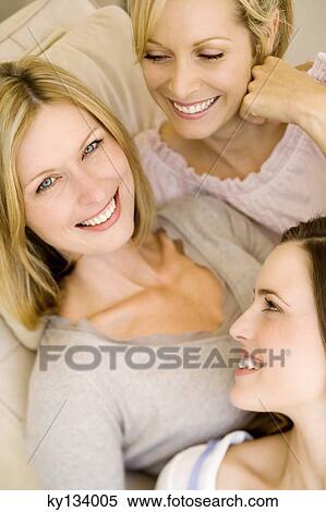 Three smiling women, indoors View Large Photo Image Stock Photography - Three smiling women, indoors. Fotosearch