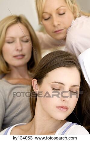 Three women with eyes-closed, indoors View Large Photo Image Stock Image - Three women with eyes-closed, indoors. Fotosearch