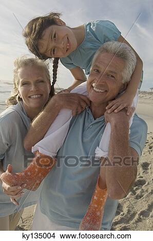 Family on the beach View Large Photo Image Picture - Family on the beach. Fotosearch