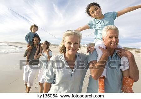 Family on the beach View Large Photo Image Picture - Family on the beach. Fotosearch