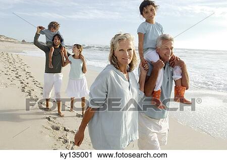 Stock Image - Family on the beach. Fotosearch