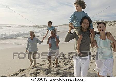 Family on the beach View Large Photo Image Stock Image - Family on the beach. Fotosearch