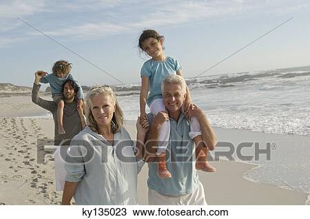 Family on the beach View Large Photo Image Stock Image - Family on the beach. Fotosearch
