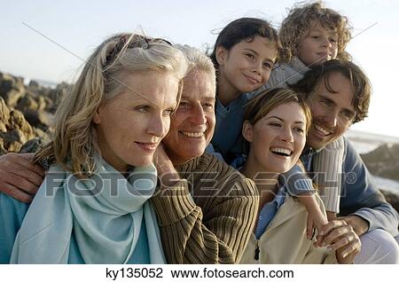 Stock Image - Family on the beach. Fotosearch