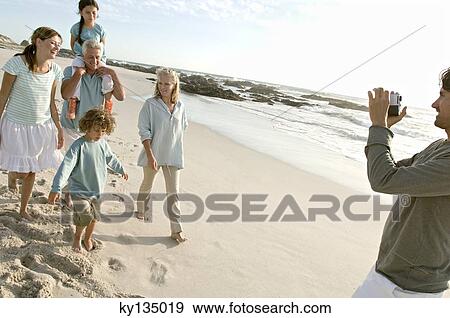 Stock Photo - Family on the beach. Fotosearch
