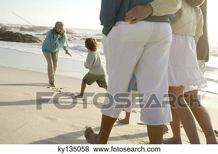 Family on the beach View Large Photo Image Stock Photo - Family on the beach. Fotosearch