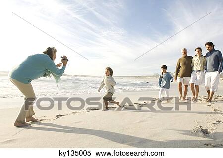Stock Photography - Family on the beach. Fotosearch