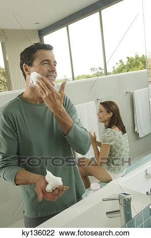 Couple in bathroom, indoors View Large Photo Image Stock Image - Couple in bathroom, indoors. Fotosearch
