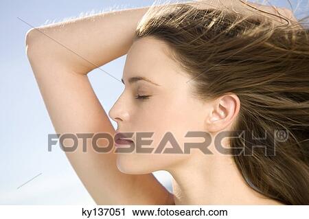 Portrait of a young woman, outdoors View Large Photo Image Stock Image - Portrait of a young woman, outdoors. Fotosearch