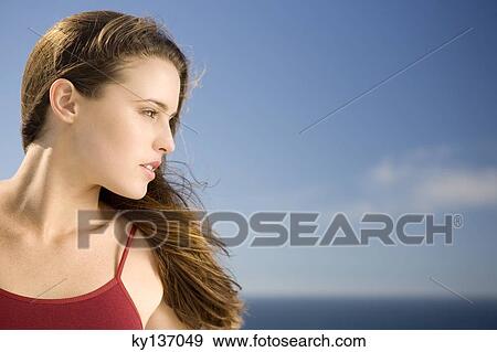 Portrait of a young woman, profil, outdoors View Large Photo Image Stock Photo - Portrait of a young woman, profil, outdoors. Fotosearch