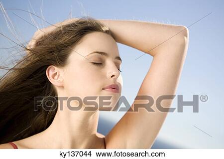 Portrait of a young woman, shut eyes, outdoors View Large Photo Image Picture - Portrait of a young woman, shut eyes, outdoors. Fotosearch