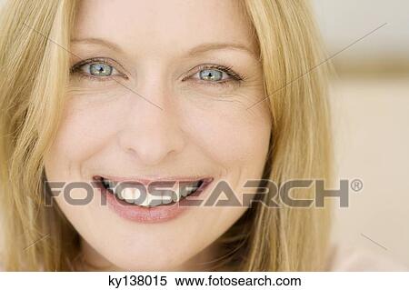 Stock Photography - Portrait of a young smiling woman. Fotosearch