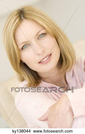 Picture - Portrait of a young woman looking at camera. Fotosearch