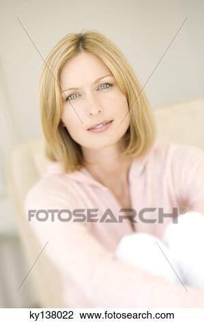 Young woman looking at camera View Large Photo Image Stock Image - Young woman looking at camera. Fotosearch