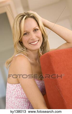 Young woman smiling for the camera View Large Photo Image Stock Image - Young woman smiling for the camera. Fotosearch