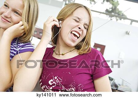 2 teen girls sharing MP3 player View Large Photo Image Stock Image - 2 teen girls sharing MP3 player. Fotosearch