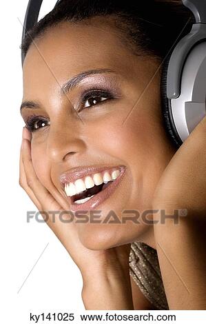 Portrait of a young woman, listening to music with headphones View Large Photo Image Stock Photography - Portrait of a young woman, listening to music with headphones. Fotosearch