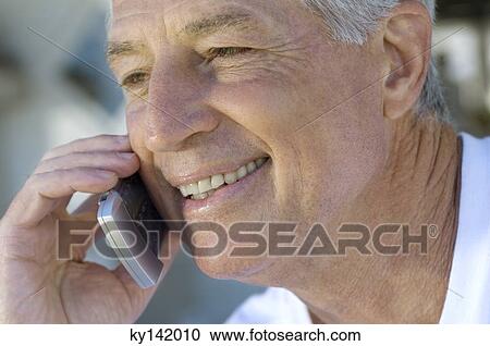 Stock Image - Portrait of man phoning. Fotosearch