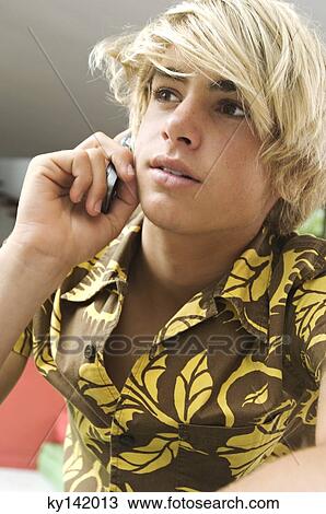 Portrait of teen boy using mobile phone View Large Photo Image Stock Image - Portrait of teen boy using mobile phone. Fotosearch
