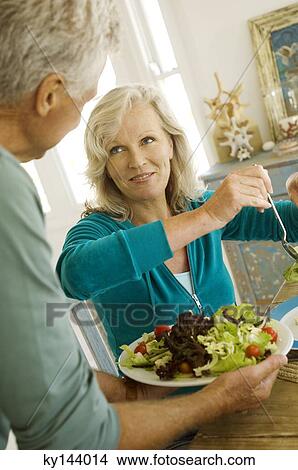 Couple having lunch View Large Photo Image Picture - Couple having lunch. Fotosearch