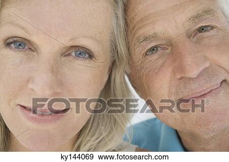 Portrait of couple looking at camera View Large Photo Image Stock Photo - Portrait of couple looking at camera. Fotosearch