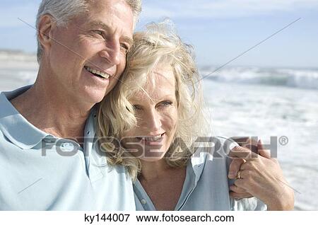 Portrait of smilin couple on the beach View Large Photo Image Stock Photo - Portrait of smilin couple on the beach. Fotosearch