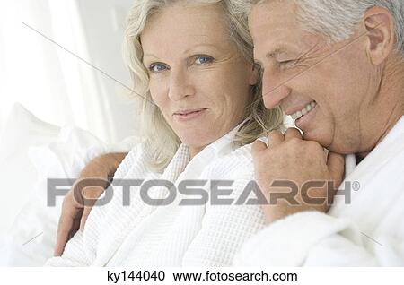Portrait of smiling couple in bathrobe View Large Photo Image Stock Image - Portrait of smiling couple in bathrobe. Fotosearch