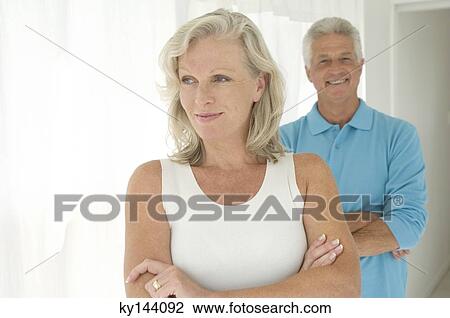 Smiling couple with arms crossed View Large Photo Image Stock Image - Smiling couple with arms crossed. Fotosearch
