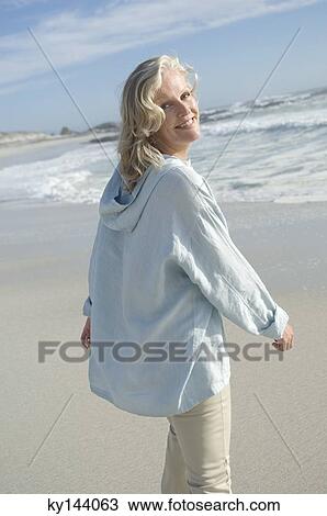 Smiling woman on the beach View Large Photo Image Stock Image - Smiling woman on the beach. Fotosearch