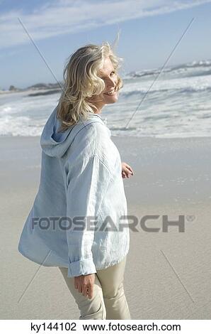 Smiling woman on the beach View Large Photo Image Stock Image - Smiling woman on the beach. Fotosearch
