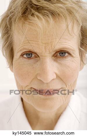 Stock Photography - Portrait of senior woman looking at camera. Fotosearch