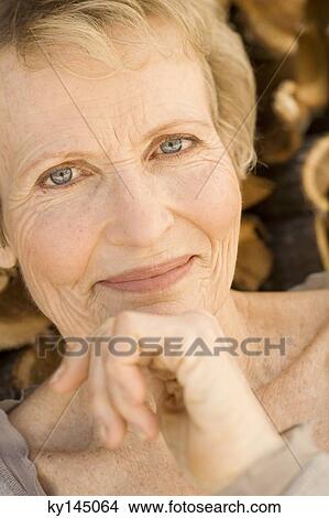 Portrait of smiling senior woman View Large Photo Image Picture - Portrait of smiling senior woman. Fotosearch