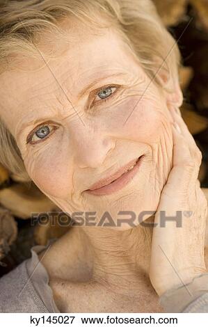 Portrait of smiling senior woman View Large Photo Image Stock Photo - Portrait of smiling senior woman. Fotosearch