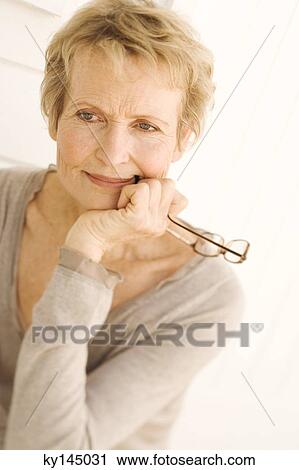 Portrait of thinking senior woman View Large Photo Image Stock Image - Portrait of thinking senior woman. Fotosearch