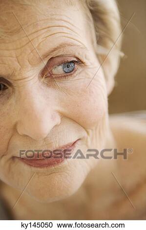 Stock Image - Portrait of thinking senior woman. Fotosearch