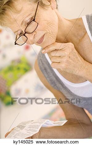 Senior woman reading View Large Photo Image Stock Photography - Senior woman reading. Fotosearch