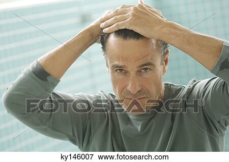 Stock Photo - Man's portrait, indoors. Fotosearch