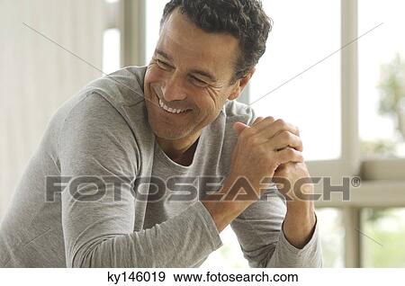 Stock Photo - Man's portrait, indoors. Fotosearch