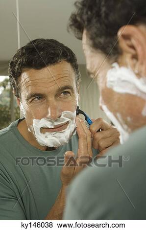 Portrait of a man shaving View Large Photo Image Stock Photo - Portrait of a man shaving. Fotosearch