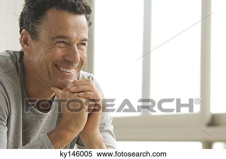 Smiling man's portrait, indoors View Large Photo Image Stock Photography - Smiling man's portrait, indoors. Fotosearch