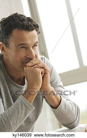 Thoughtful man's portrait View Large Photo Image Stock Photo - Thoughtful man's portrait. Fotosearch