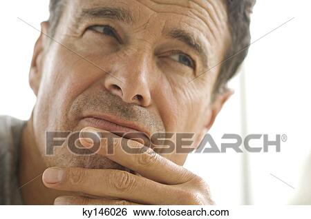 Thoughtful man's portrait View Large Photo Image Stock Photograph - Thoughtful man's portrait. Fotosearch