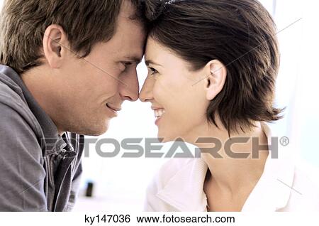 Portrait of couple, head to head, view in profile View Large Photo Image Stock Photograph - Portrait of couple, head to head, view in profile. Fotosearch
