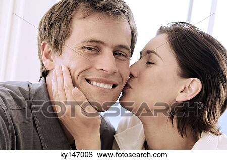 Portrait of woman kissing man View Large Photo Image Stock Image - Portrait of woman kissing man. Fotosearch