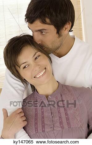 Young couple embracing View Large Photo Image Stock Photography - Young couple embracing. Fotosearch