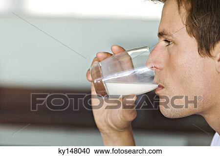 Portrait of man drinking milk View Large Photo Image Stock Image - Portrait of man drinking milk. Fotosearch