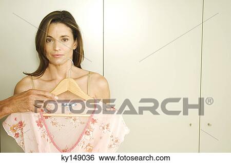Man giving dress to woman View Large Photo Image Stock Photograph - Man giving dress to woman. Fotosearch
