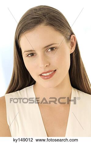 Portrait of a young woman looking at camera View Large Photo Image Stock Image - Portrait of a young woman looking at camera. Fotosearch