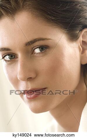 Picture - Portrait of young woman loooking at camera. Fotosearch